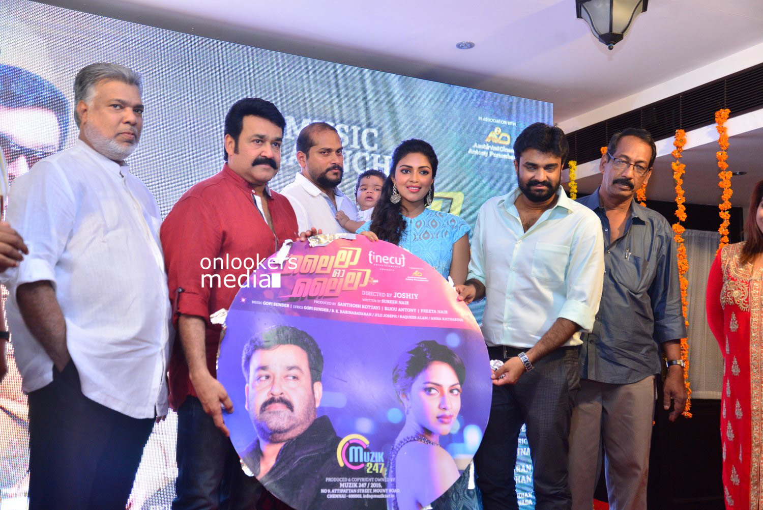 https://onlookersmedia.in/wp-content/uploads/2015/04/Lalila-O-Laila-Audio-Launch-Stills-Images-Mohanlal-Amala-Paul-Malayalam-Movie-2015-Onlookers-Media-62.jpg