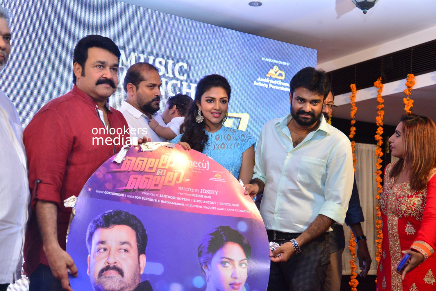 https://onlookersmedia.in/wp-content/uploads/2015/04/Lalila-O-Laila-Audio-Launch-Stills-Images-Mohanlal-Amala-Paul-Malayalam-Movie-2015-Onlookers-Media-63.jpg