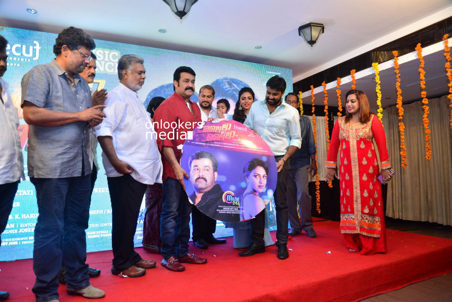 https://onlookersmedia.in/wp-content/uploads/2015/04/Lalila-O-Laila-Audio-Launch-Stills-Images-Mohanlal-Amala-Paul-Malayalam-Movie-2015-Onlookers-Media-65.jpg