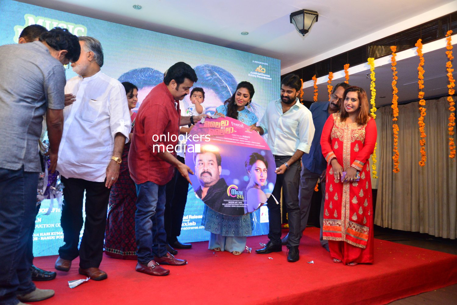 https://onlookersmedia.in/wp-content/uploads/2015/04/Lalila-O-Laila-Audio-Launch-Stills-Images-Mohanlal-Amala-Paul-Malayalam-Movie-2015-Onlookers-Media-66.jpg