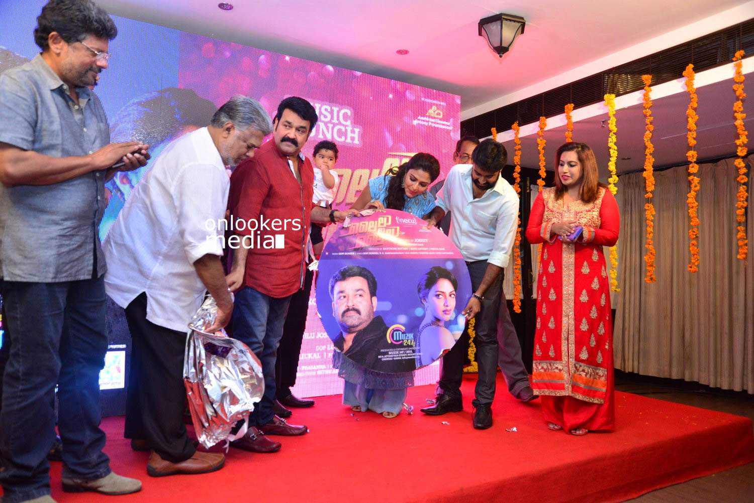 https://onlookersmedia.in/wp-content/uploads/2015/04/Lalila-O-Laila-Audio-Launch-Stills-Images-Mohanlal-Amala-Paul-Malayalam-Movie-2015-Onlookers-Media-67.jpg