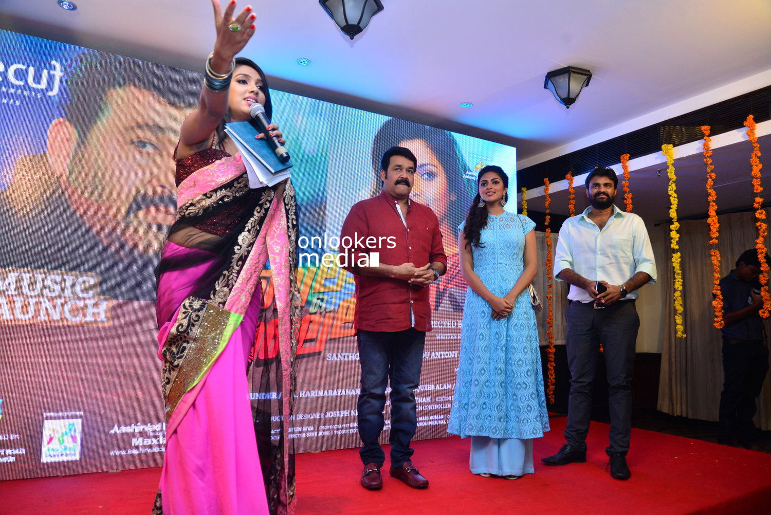 https://onlookersmedia.in/wp-content/uploads/2015/04/Lalila-O-Laila-Audio-Launch-Stills-Images-Mohanlal-Amala-Paul-Malayalam-Movie-2015-Onlookers-Media-79.jpg