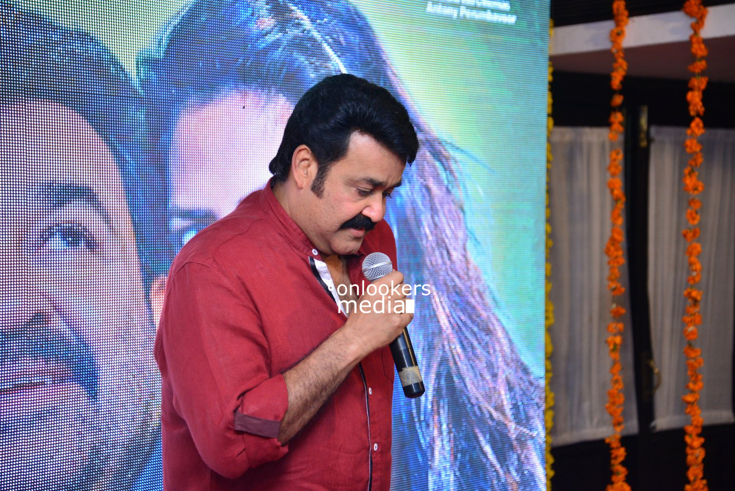 https://onlookersmedia.in/wp-content/uploads/2015/04/Mohanlal-at-Lalila-O-Laila-Audio-Launch-Stills-Images-Amala-Paul-Malayalam-Movie-2015-Onlookers-Media-1.jpg