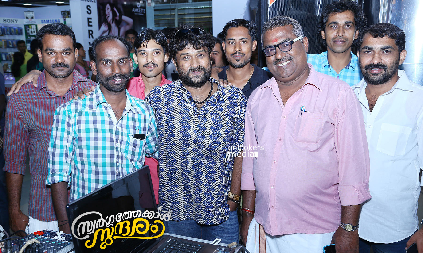 https://onlookersmedia.in/wp-content/uploads/2015/04/Swargathekkal-Sundaram-Audio-Launch-Stills-Lal-Sreenivasan-Mythili-Malayalam-Movie-2015-Onlookers-Media-3.jpg